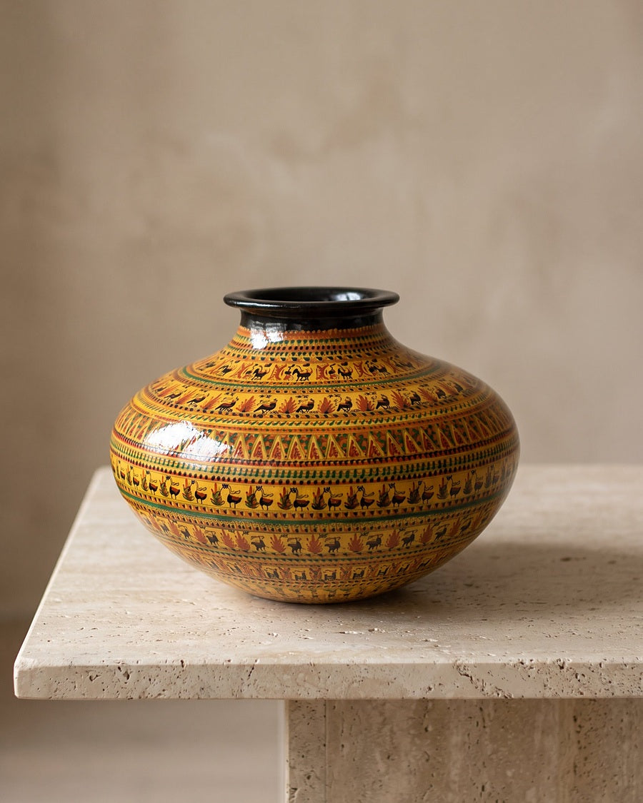 Hand-painted ceramic sphere jar on a travertine plinth