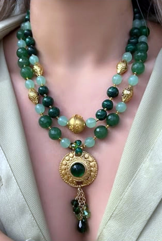 Two-strand jade and malachite necklace set with a hammered gold medallion and green cabochon